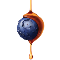 Fresh blueberry covered in golden honey or syrup dripping down, creating an artistic food photography composition