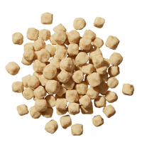 Scattered light brown chickpeas or garbanzo beans arranged in a circular pattern on white background