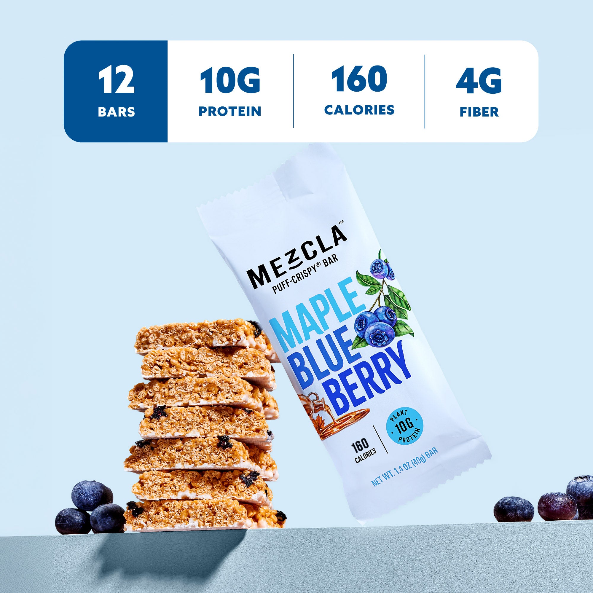 Stack of maple blueberry protein bars next to white packaging, with nutritional info showing 12 bars, 10g protein, 160 calories, 4g fiber