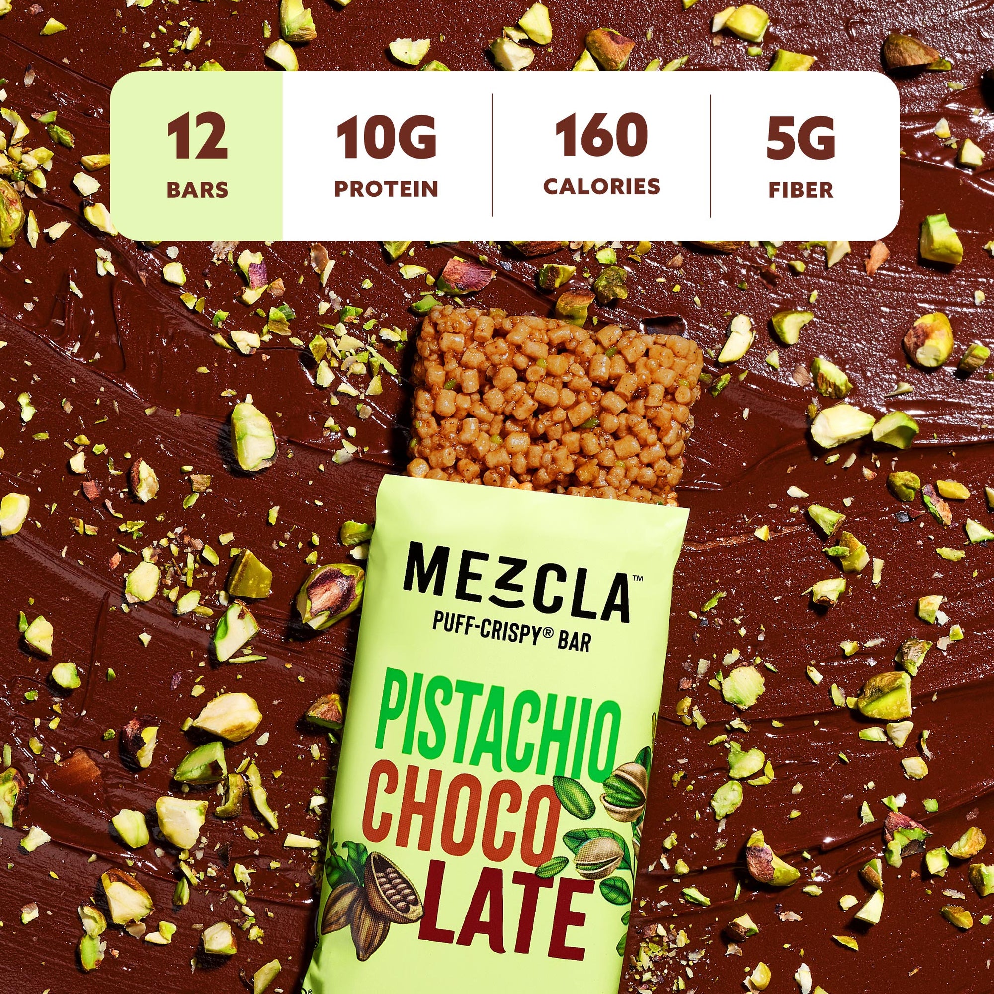 Mezcla Pistachio Chocolate protein bar on wood surface with scattered pistachios, showing 12 bars, 10g protein, 160 calories, 5g fiber