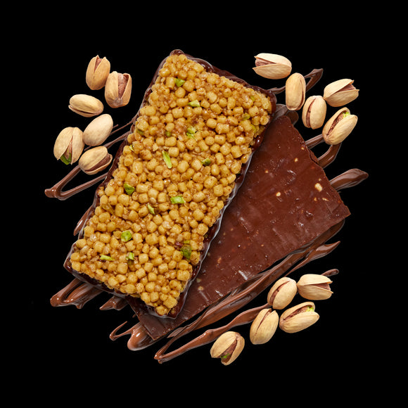 Arrangement of the bar with pistachios and a stamp showing the product is made with pistachios from Italy