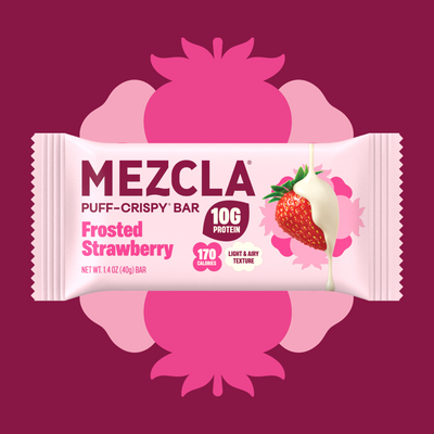 MEZCLA Puff-Crispy Bar in Frosted Strawberry flavor packaging with pink and white design, showing 10g protein, 170 calories, featuring white chocolate-dipped strawberry image