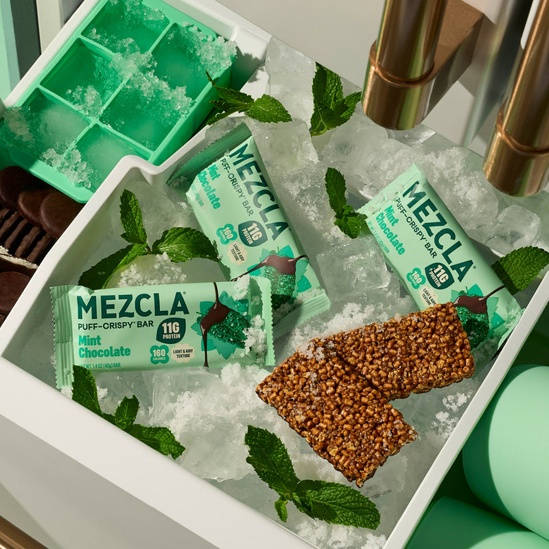 MEZCLA Mint Chocolate protein bars on ice with fresh mint leaves in white tray, green ice cube mold visible