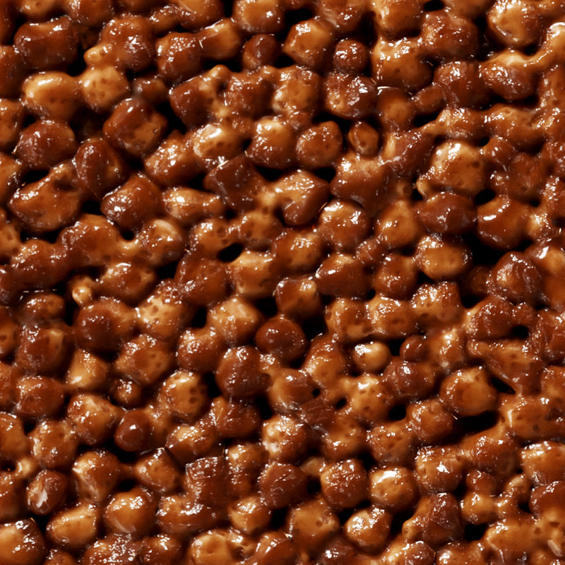 Glossy brown candied walnuts with a shiny caramelized coating clustered together