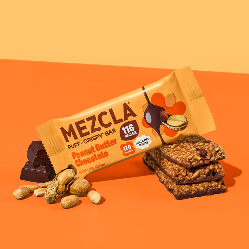 MEZCLA Puff-Crispy Bar in Peanut Butter Chocolate flavor with 11g protein and 170 calories, shown with scattered peanuts and stacked bars on orange background
