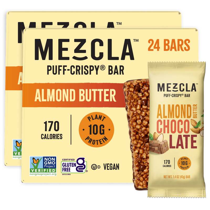 Two boxes of Mezcla Puff-Crispy protein bars in Almond Butter and Almond Chocolate flavors, showing 24-count packaging with nutritional details and certifications on cream-colored boxes.