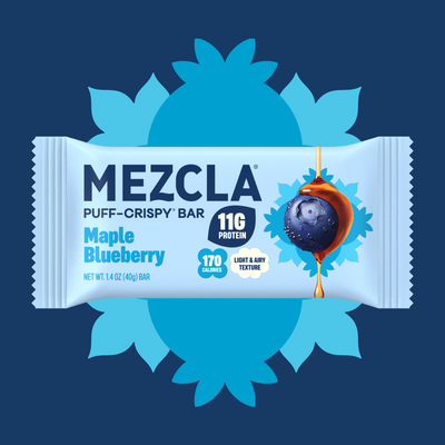 MEZCLA Maple Blueberry puff-crispy protein bar package on blue sunburst background, showing 11g protein, 170 calories, with blueberry and maple syrup imagery