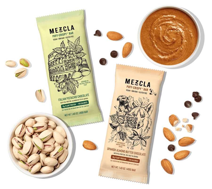 Pistachio chocolate and almond butter chocolate bars surrounded by pistachios and almond butter